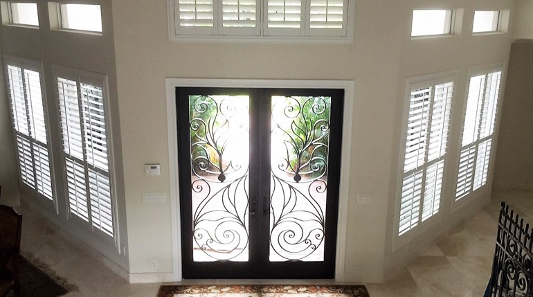 San Antonio foyer with glass doors and interior shutters